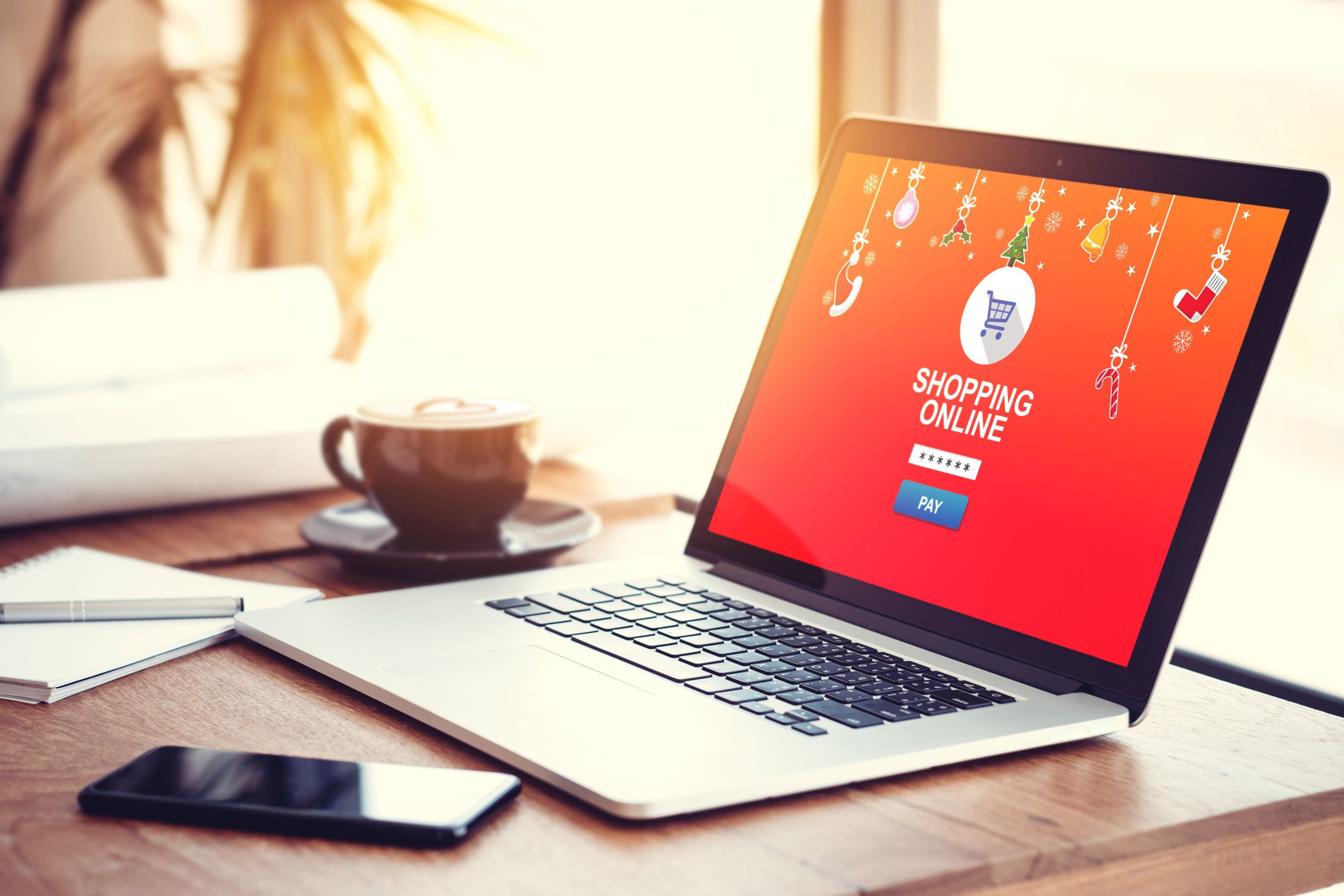 Image of a laptop with a red screen on a desk