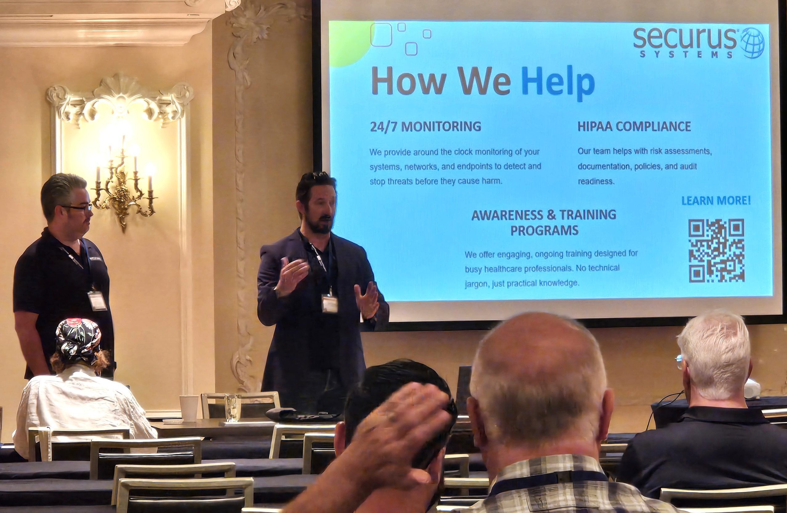 Securus Systems team presenting how they help businesses to a room of attendees